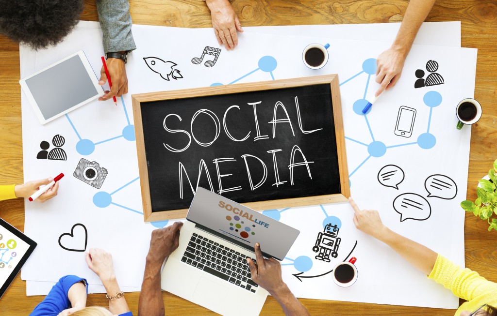 Group of Multiethnic People Discussing Social Media